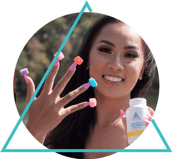 Girl smiling while holding delta 8 gummies flavors in hand